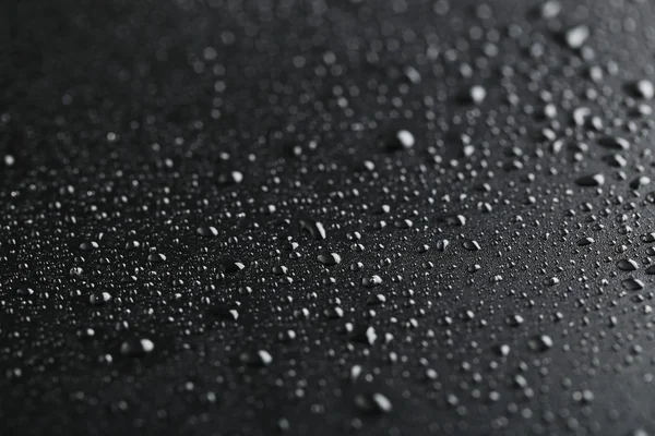Water drops on a black — Stock Photo, Image