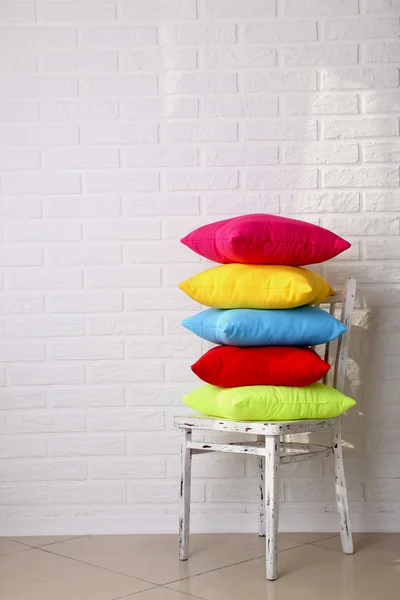 Colorful pillows on chair — Stock Photo, Image