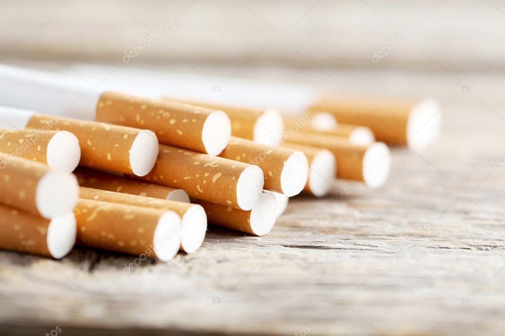 Tobacco cigarettes on table