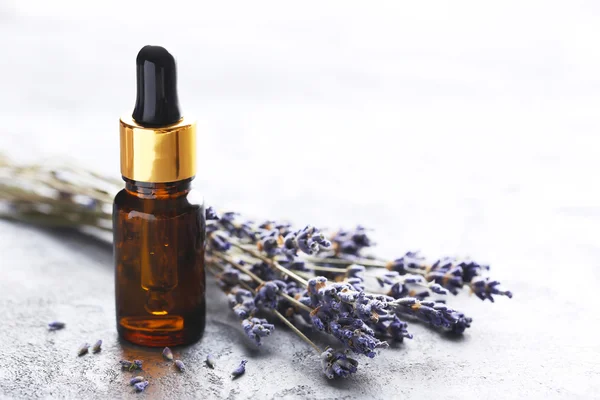 Lavender oil and flowers — Stock Photo, Image