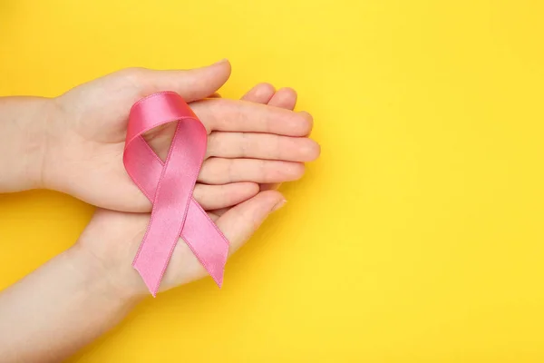 Breast Cancer Concept Female Hands Pink Ribbon Yellow Background — Stock Photo, Image