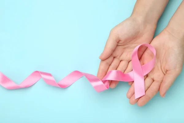 Breast Cancer Concept Female Hands Pink Ribbon Blue Background — Stock Photo, Image