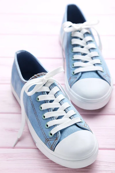 Pair Blue Sneakers Pink Wooden Table — Stock Photo, Image