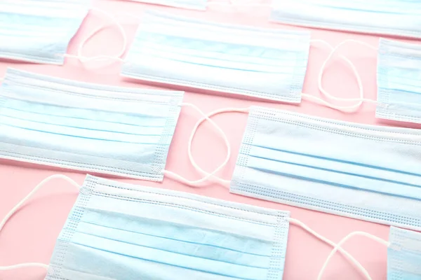 Medicine face masks on pink background