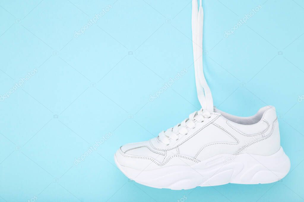 White shoe on blue background