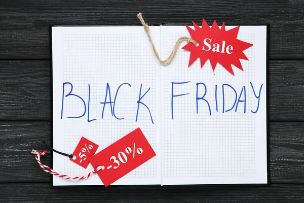 Inscrição Black Friday Notepad Red Tags Black Wooden Background — Fotografia de Stock