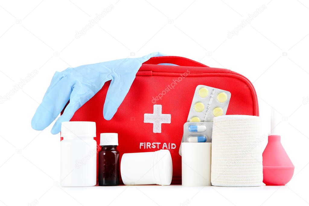 First aid kit with medical supplies isolated on white background
