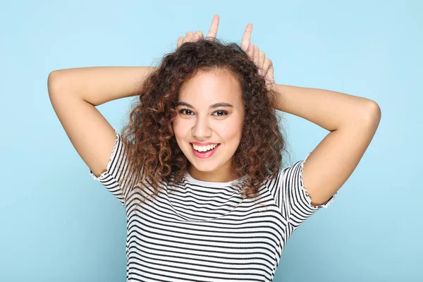Young American Girl Showing Rabbit Ears Fingers Blue Background — 图库照片