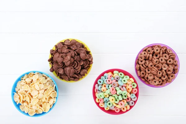 Verschiedene Cornflakes Schalen Auf Weißem Holztisch — Stockfoto