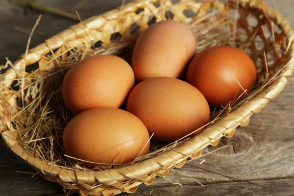 Fresh eggs in basket — Stock Photo, Image