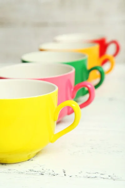 Colorful cups on white background — Stock Photo, Image