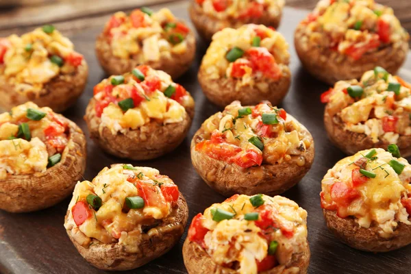 Stuffed mushrooms on cutting board