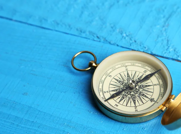 Compass on blue wooden background — Stock Photo, Image