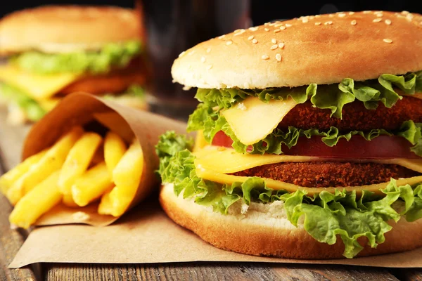 Big burger on wooden background — Stock Photo, Image