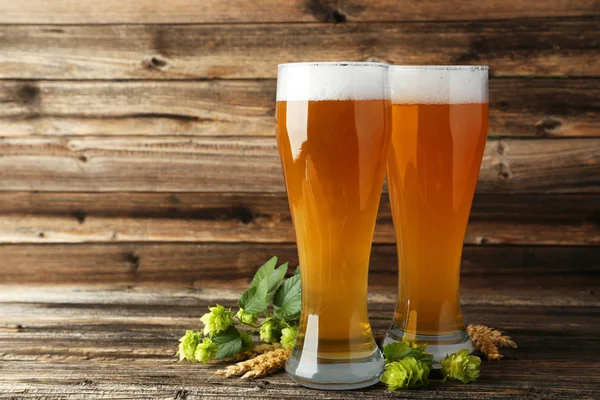 Glasses of beer with ears of wheat and hops — Stock Photo, Image