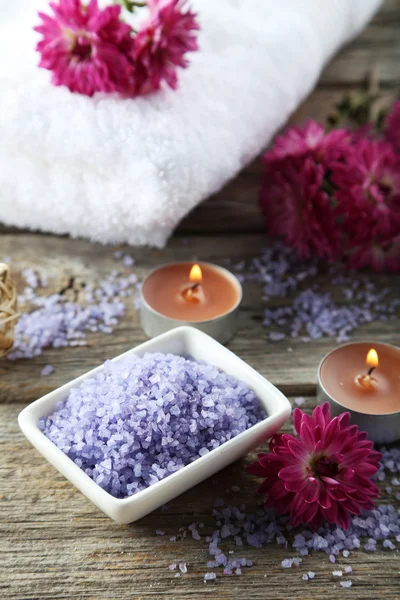 Sea salt in bowl with candles — Stock Photo, Image