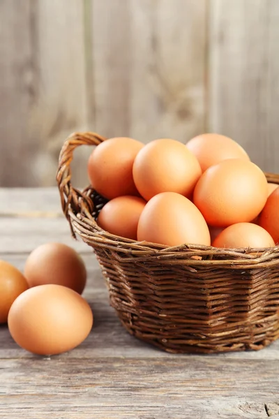 Chicken eggs in basket — Stock Photo, Image