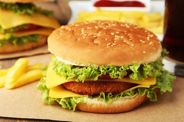 Big burger on wooden background — Stock Photo, Image