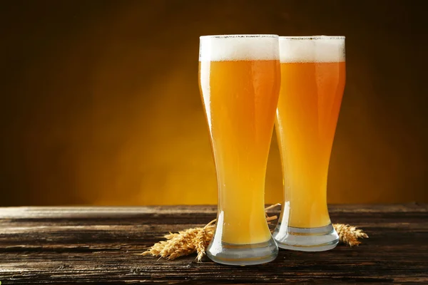 Glasses of beer with ears of wheat — Stock Photo, Image