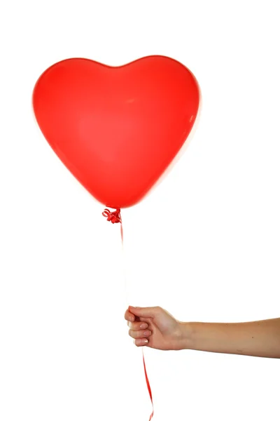 Hand som håller ett rött hjärta ballong — Stockfoto