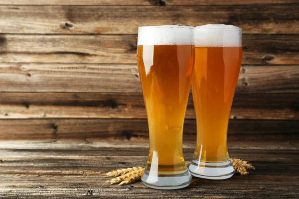 Glasses of beer with ears of wheat — Stock Photo, Image