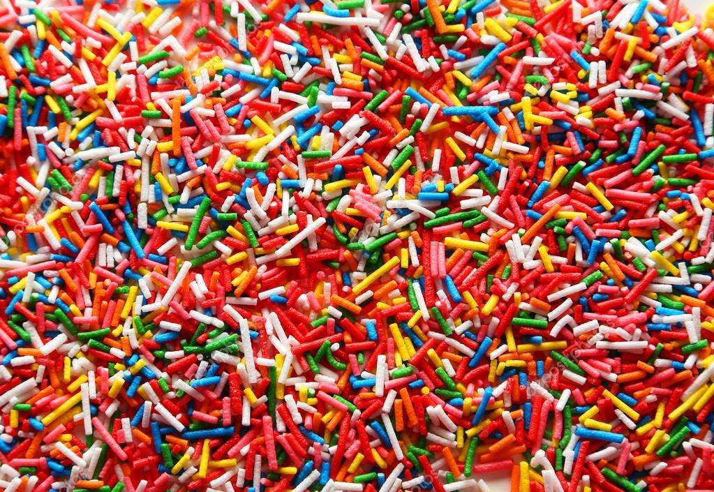 Colorful sprinkles background — Stock Photo © 5seconds 63085583