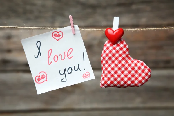 Love hearts and note on rope — Stock Photo, Image