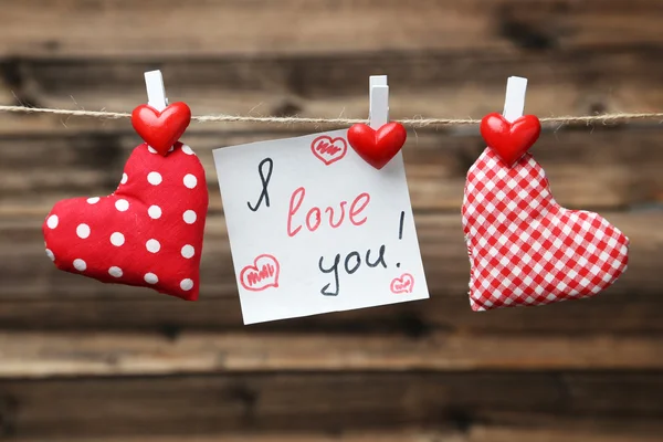 Love hearts and note on rope — Stock Photo, Image