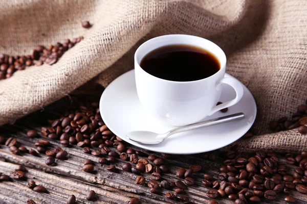 Cup with coffee beans — Stock Photo, Image