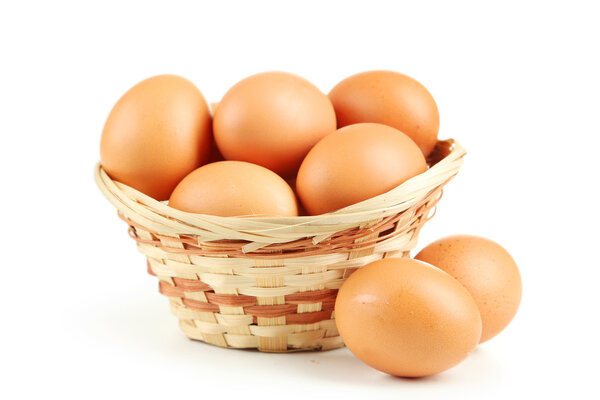 Chicken eggs in basket
