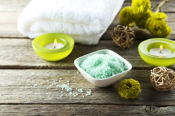 Sea salt in bowl with candles — Stock Photo, Image