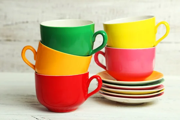 Colorful cups and saucers — Stock Photo, Image