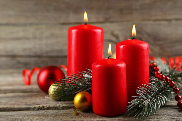 Branch of Christmas tree and candles — Stock Photo, Image