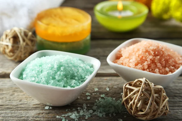 Sea salt in bowls with candle — Stock Photo, Image