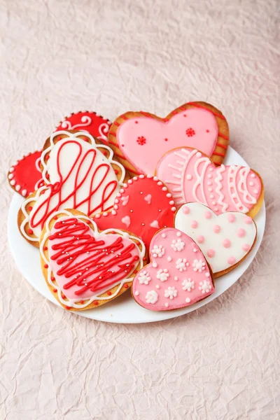 Heart cookies on white plate — Stock Photo, Image