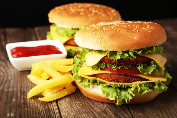 Big burgers with french fries and ketchup — Stock Photo, Image