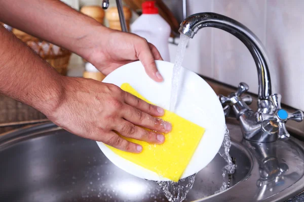 Male hand washing dish — Stock Photo, Image