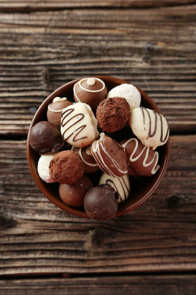 Sweet chocolates in bowl — Stock Photo, Image