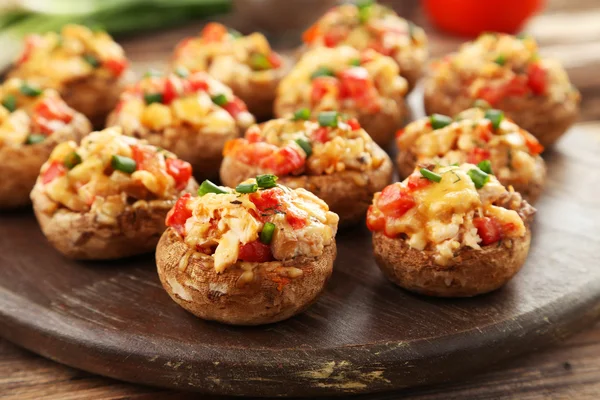 Stuffed mushrooms on cutting board