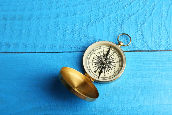 Compass on blue wooden background — Stock Photo, Image