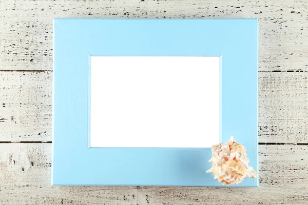 Wood frame and seashell — Stock Photo, Image