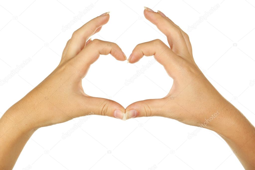 Woman hands making heart