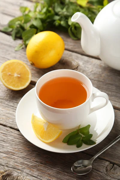 Cup and teapot with tea — Stock Photo, Image