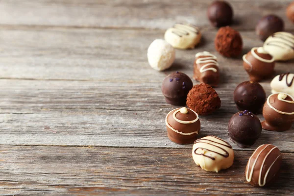 Chocolates doces no fundo — Fotografia de Stock