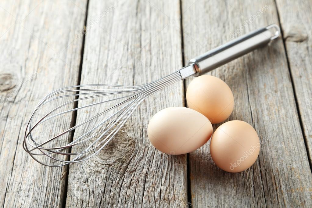 Egg whisk with eggs