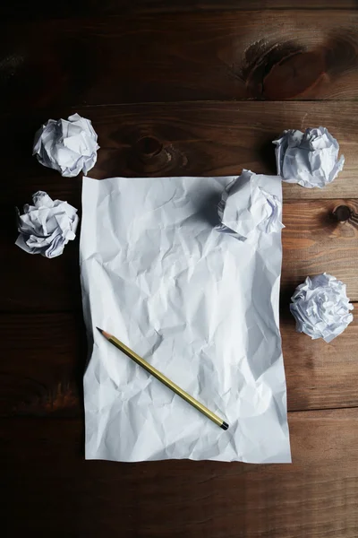 Crumpled up papers with pencil — Stock Photo, Image