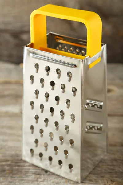 Metal grater on table — Stock Photo, Image