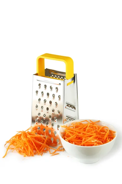 Металлическая решетка и морковь — стоковое фото