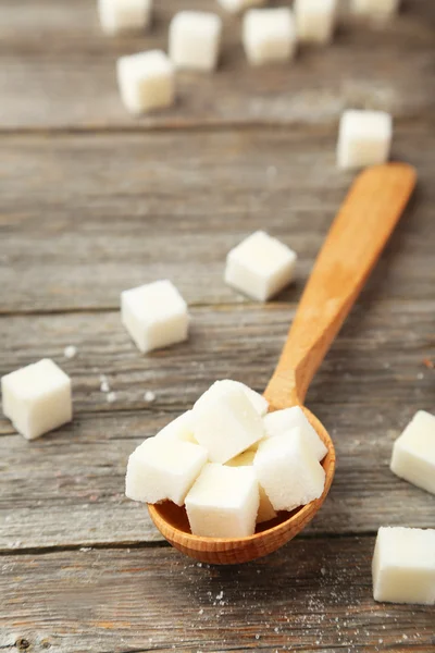 Sugar cubes in spoon — Stock Photo, Image