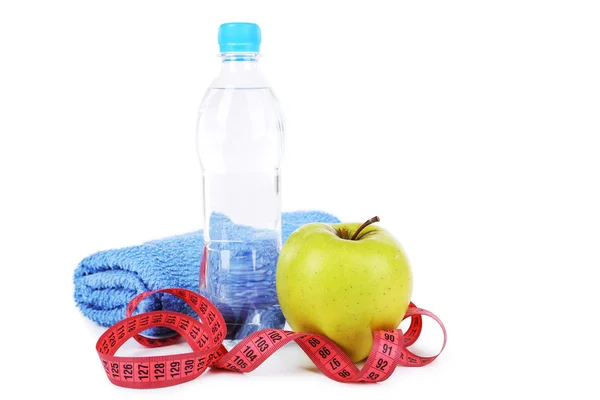 Manzana con cinta métrica y botella de agua — Foto de Stock